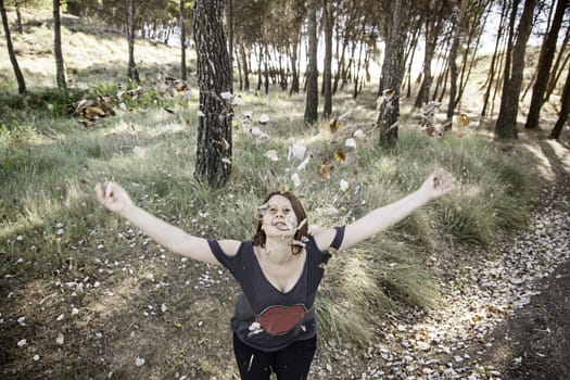 Woman autumn leaves in park with trees, nature