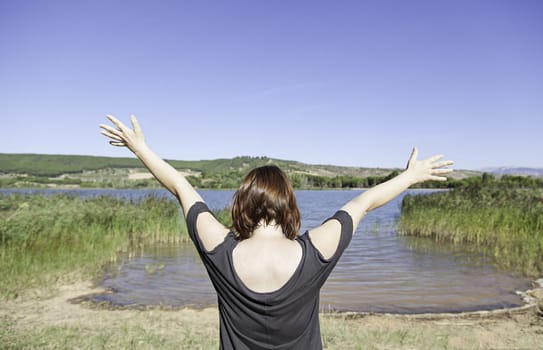 Natural landscape with river and nature girl outdoors