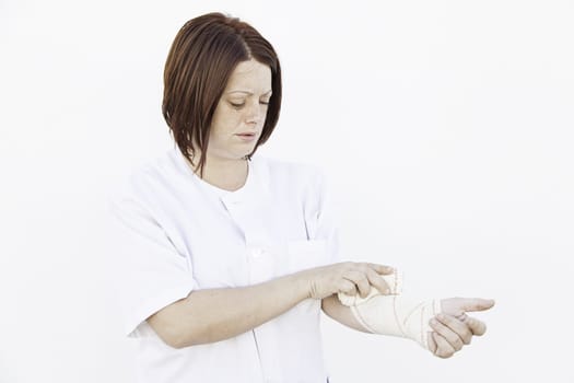 Girl bandaged arm in medical clinic, fracture