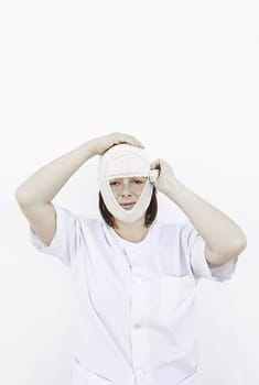 Girl with broken head bandaging, medicine