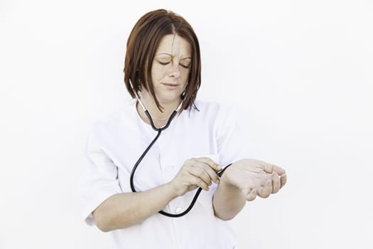 Nurse with stethoscope wearing gown, medicine and health