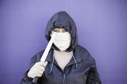 Aggressive hooded woman, violence and lifestyle