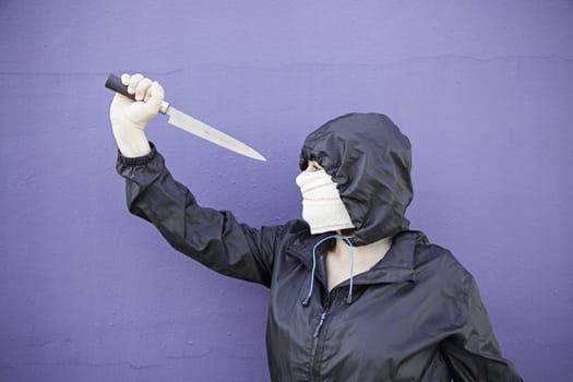 Aggressive hooded woman, violence and lifestyle
