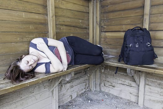 Girl resting on cabin bag, tour and outer
