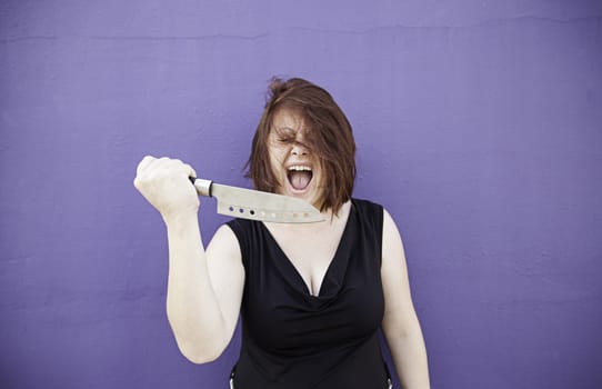 Crazy with knife screaming, violence and danger