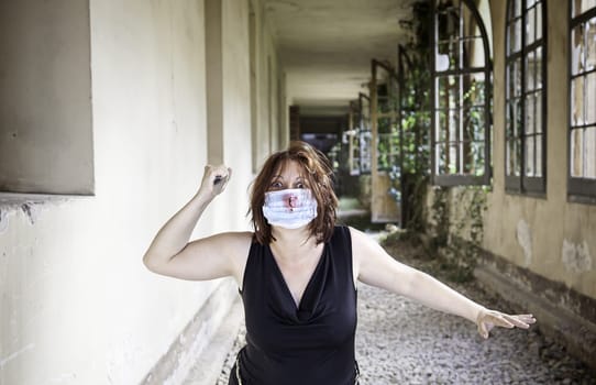 Psycho girl with knife and medical mask