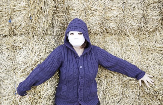 Masked woman in barn farm, halloween