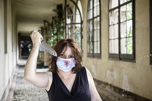 Psycho girl with knife and medical mask