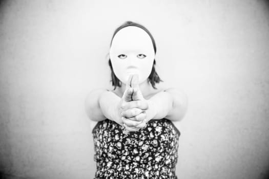 Girl in white mask on halloween, mystery