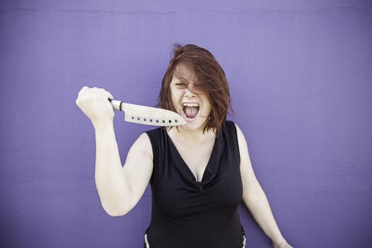 Crazy with knife screaming, violence and danger