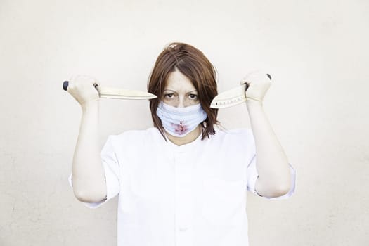 Nurse with knives and bloody mask, halloween