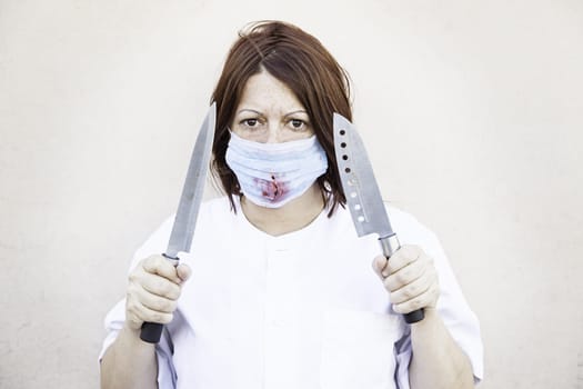 Nurse with knives and bloody mask, halloween