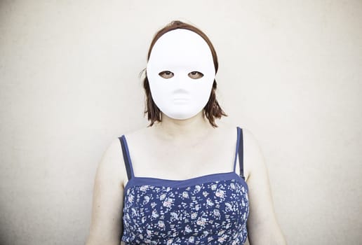 Girl in white mask on halloween, mystery