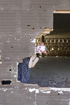 Clown in abandoned house door, fear and halloween