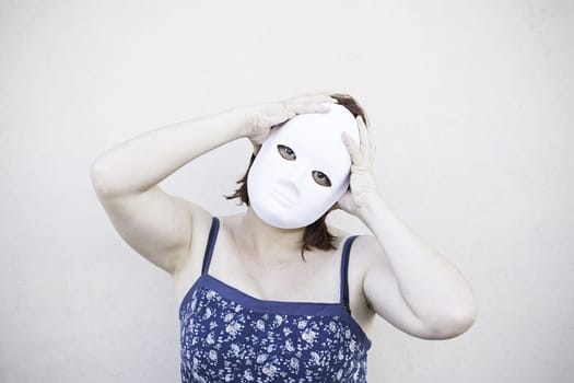 Girl in white mask on halloween, mystery