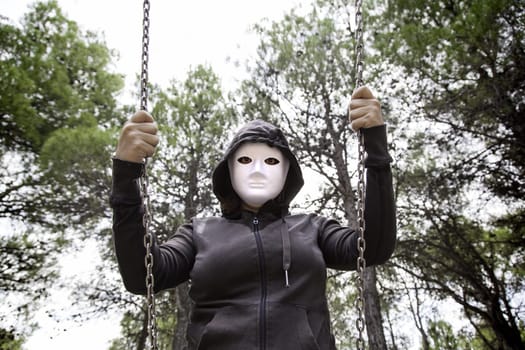 Aggressive hooded woman, violence and lifestyle