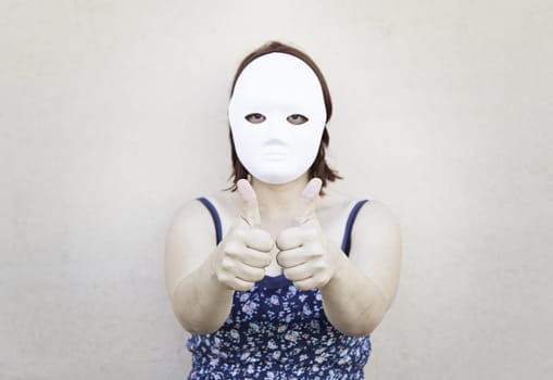 Girl in white mask on halloween, mystery