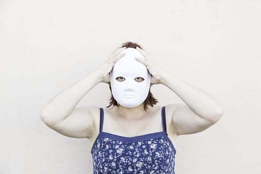 Girl in white mask on halloween, mystery