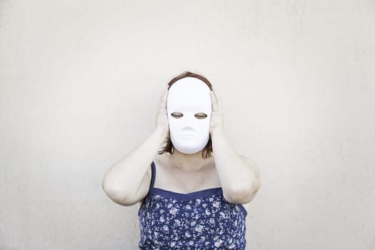 Girl in white mask on halloween, mystery