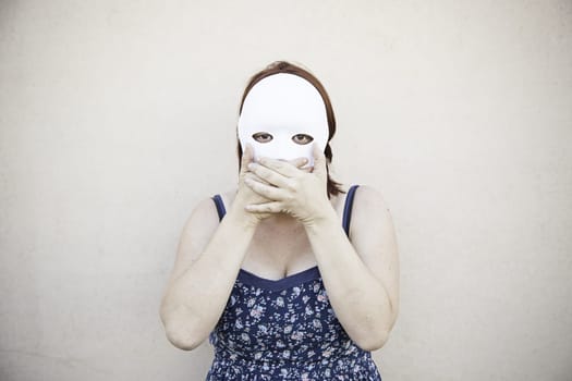 Girl in white mask on halloween, mystery