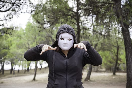 Forest hooded murderer, fear and halloween