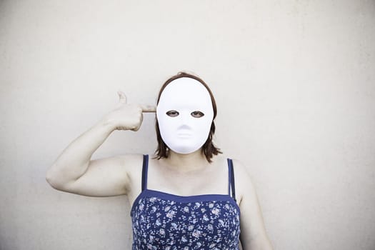 Girl in white mask on halloween, mystery