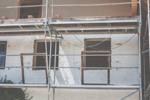 Loft conversion, renovation, renovation and dismantled windows on a construction site.