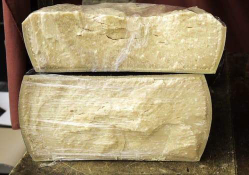 Sheep cured cheese in food market, handmade food