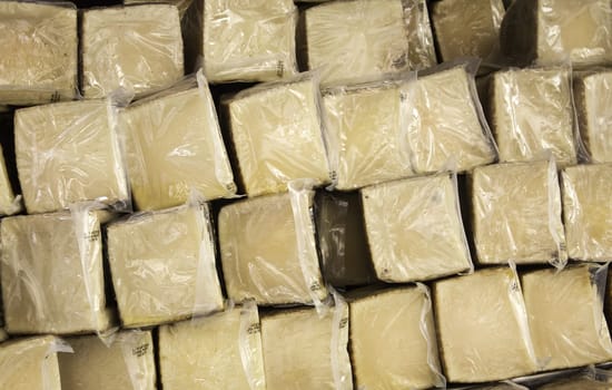Sheep cured cheese in food market, handmade food