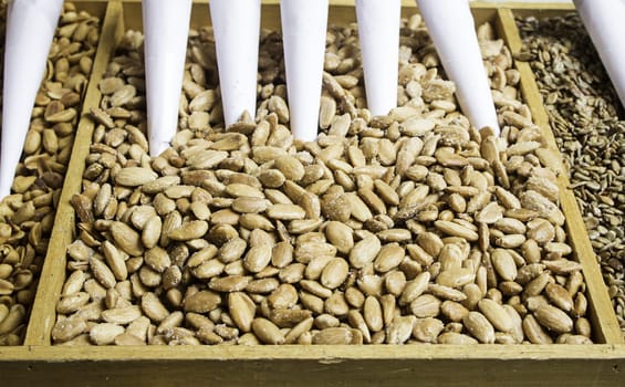 Almonds with sugar in food market, fruits...