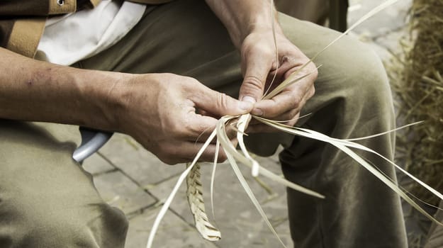 Man working wicker braids, business and industry