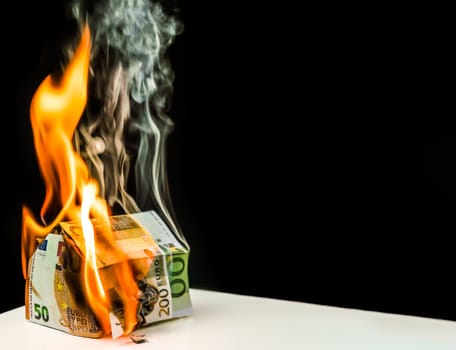 House Made up of EUR Banknote Burning In Fire