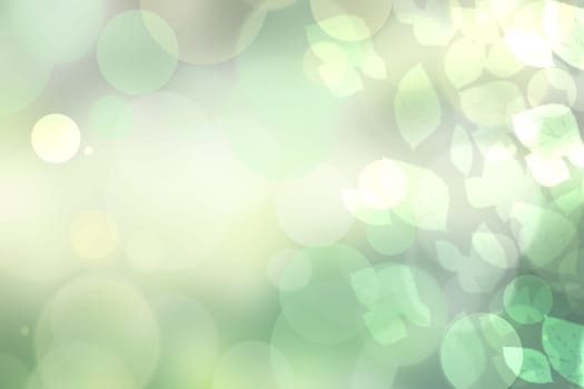 Sunny abstract bright green bokeh autumn background texture with leaves. Space for your design.