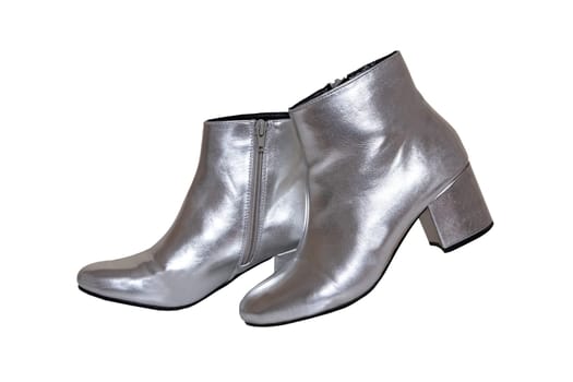 Womens boots and shoes. A pair female silver boots isolated on a white background. Leather shoe fashion new collection 2019.