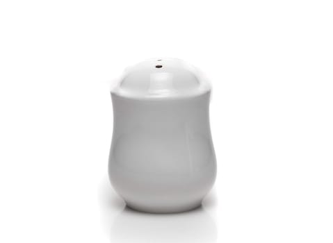 white dishes on a white background pepper