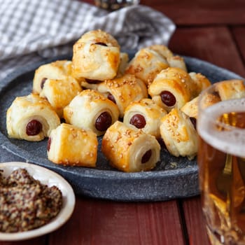 Savoury snack with puff pastry and sausages / pigs in a blanket