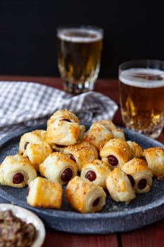 Savoury snack with puff pastry and sausages / pigs in a blanket