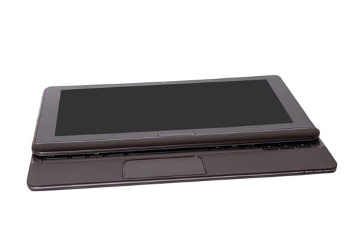Computer technology background. Close up of modern portable laptop with a dark or black blank screen isolated on a white background.