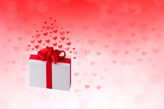 Happy Valentines or wedding day. Abstract love romantic holiday red background with hearts and a gift box with red ribbon. Template with space fro your design.