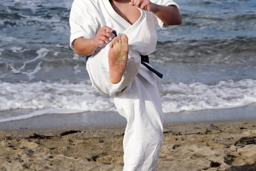 Japanese karate martial arts training at the beach