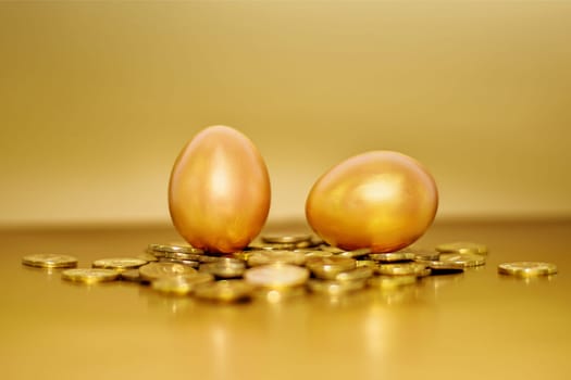 Gold coins and golden eggs, the concept of financial growth.