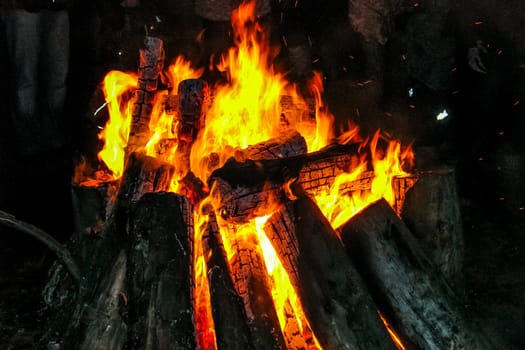 Flames of a campfire in the night. Fire brand.  Camp fire. Tourism in Latvia.