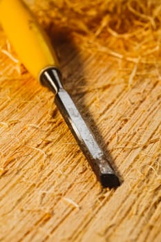 wood chips and cutters lie on a wooden board.