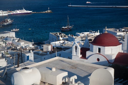 panoramic view of the Mykonos town harbor from the above hills on a sunny summer day, Mykonos, Cyclades, Greece