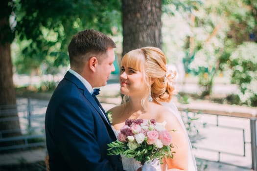 bride and groom on the background of the city.