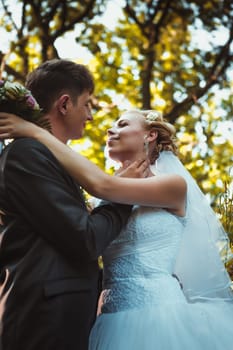 bride and groom on the forest background.