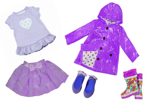 Collage set of children clothes. Collection of spring and summer clothes isolated on a white background. Closeup of lilac or purple clothes.
