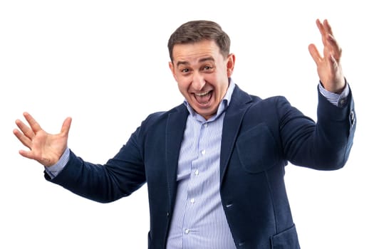 Handsome young businessman celebrating his success gesticulating and shouting