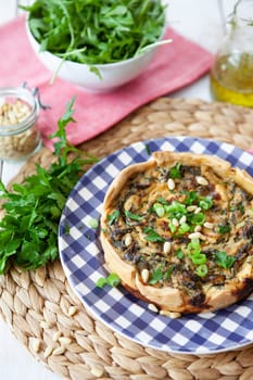Little quiche with fresh parsley and pine seeds