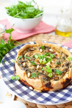 Little quiche with fresh parsley and pine seeds